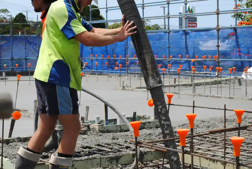 man poring concrete man poring concrete