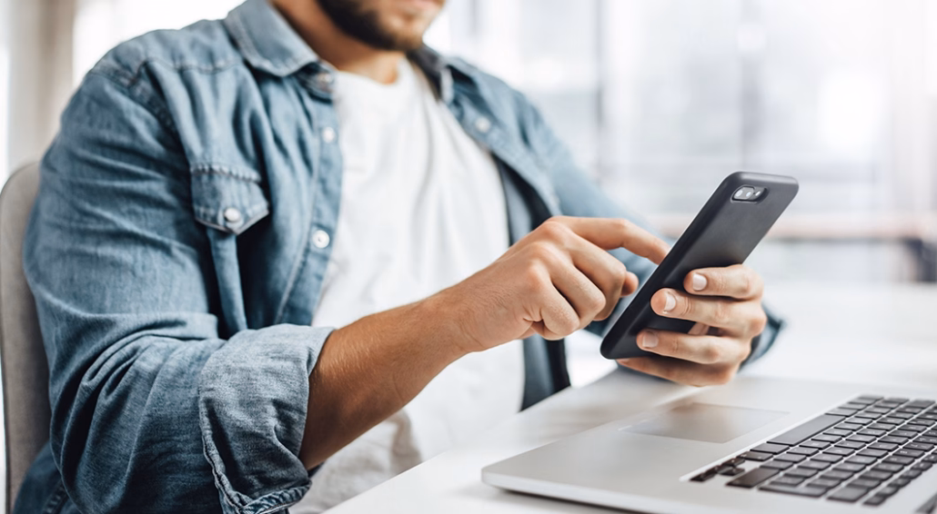 man using tablet on worksite